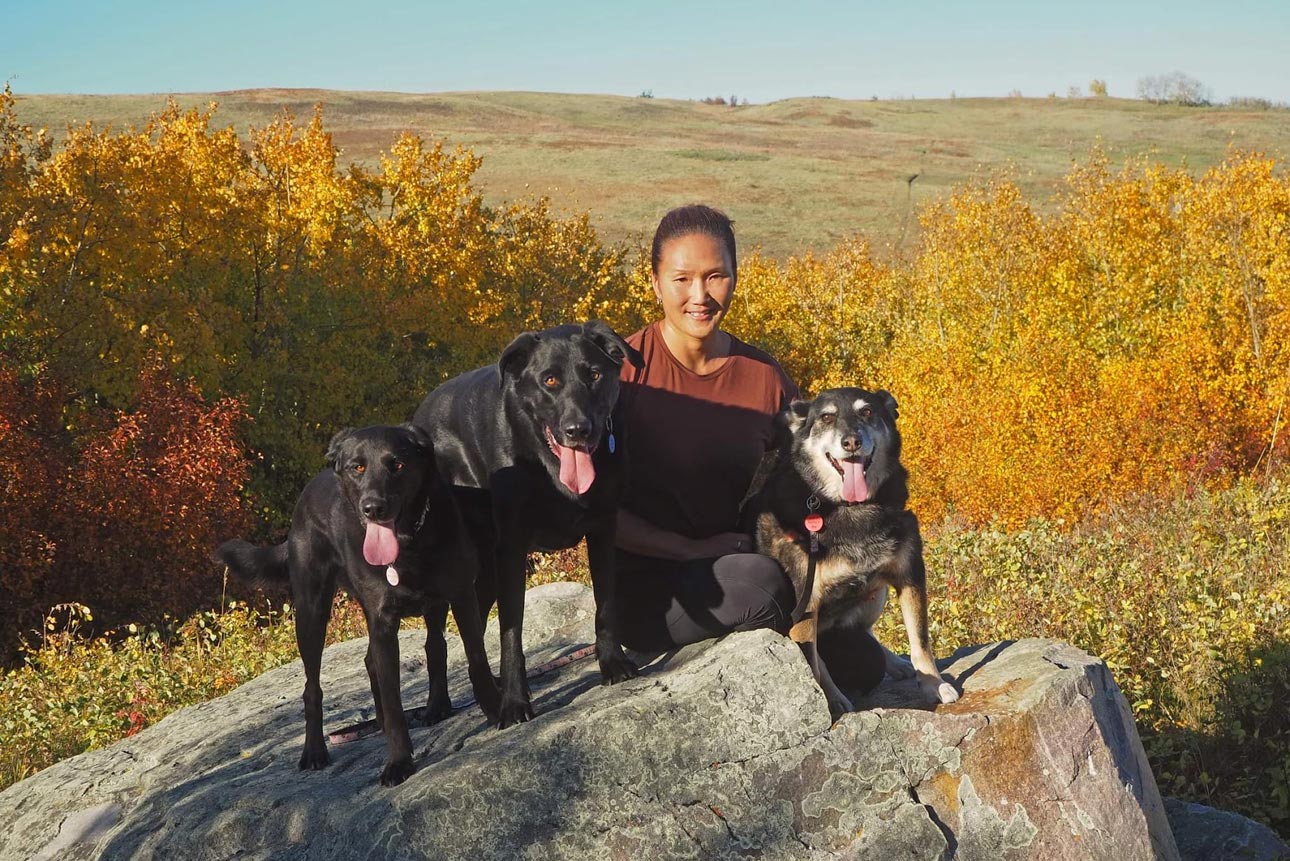 Photo of Cathryn Hanssen and her three dogs